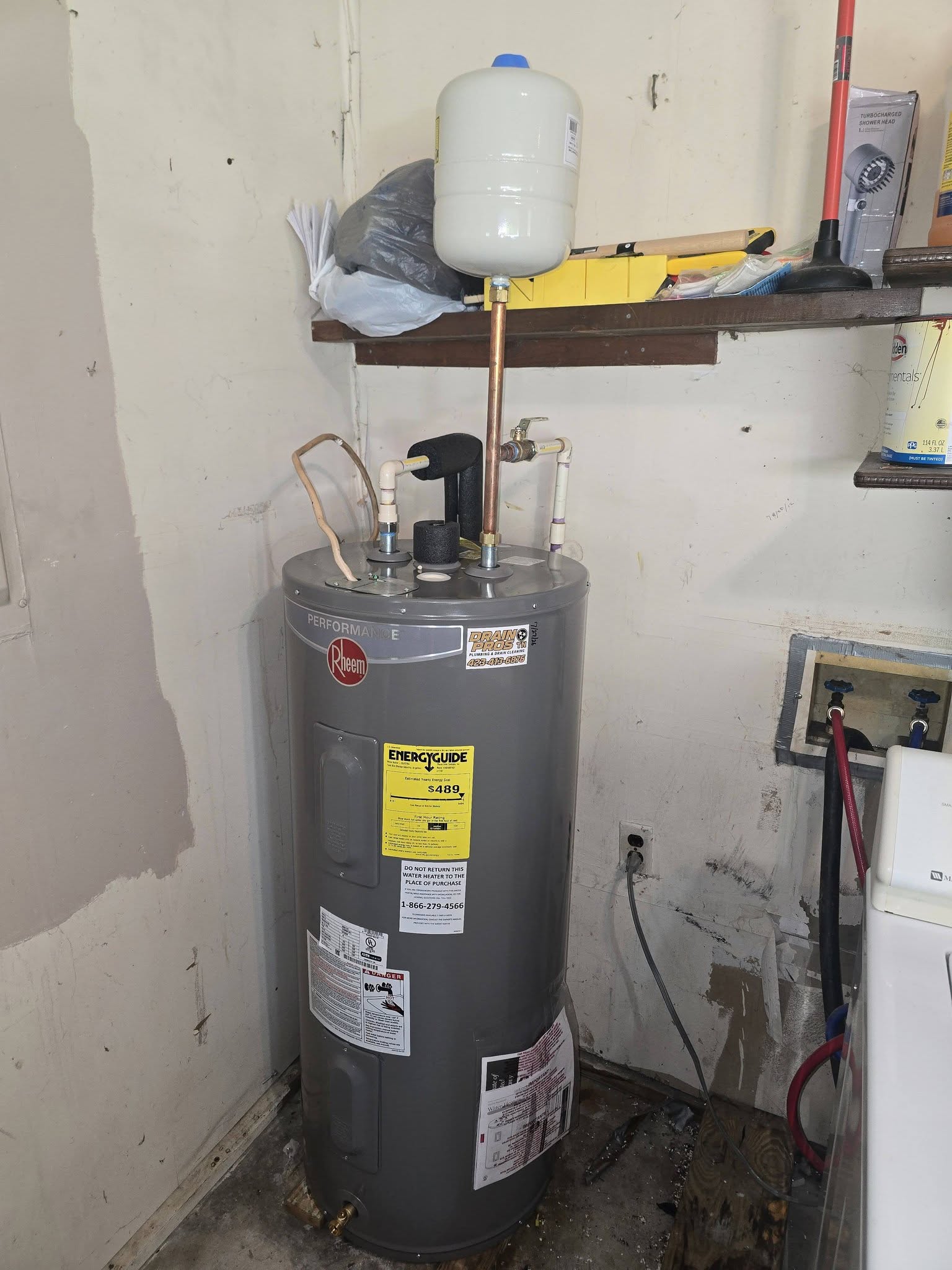 The replacement water heater installed and connected
